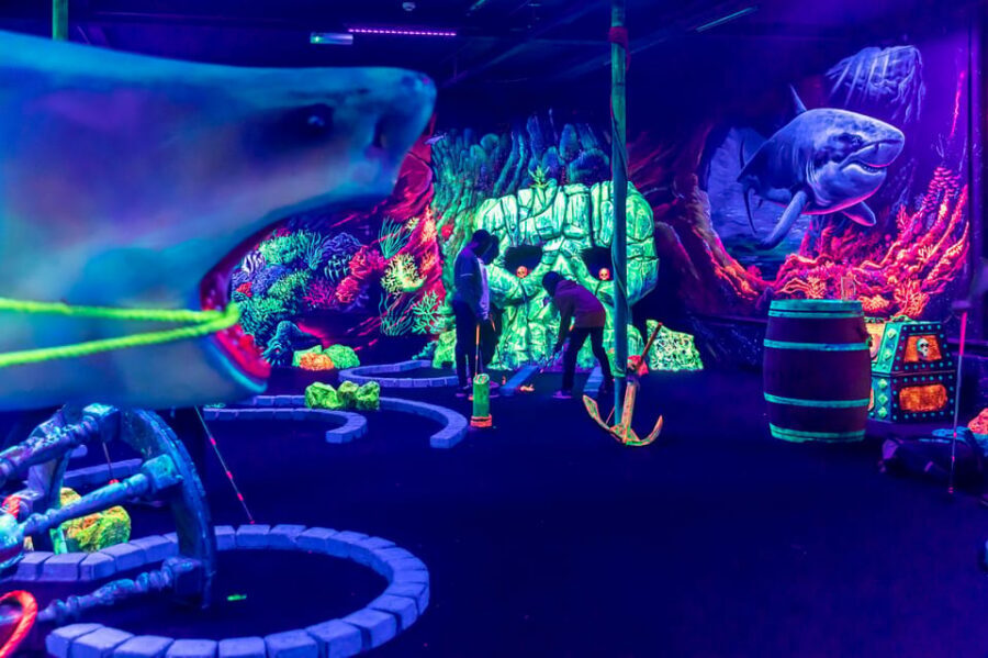 Aloha Amsterdam: 12-Hole Glow-in-the-Dark Mini-Golf - Inside the course: maritime pirates on one side, underwater on the other