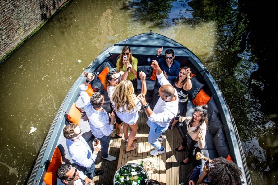 Amsterdam: Canal Belt Private Beer Boat Tour - Boarding day setup: open-top comfort and group vibe