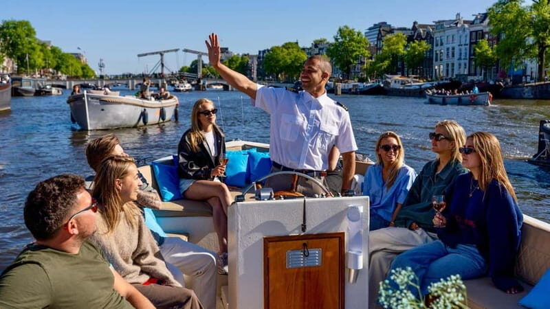 Amsterdam: Canal Cruise in Open Boat with Drink Option - Key things that make this canal cruise worth your $19