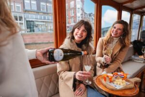 Amsterdam: Canal Cruise with Bubbles & Bites - From Jordaan to the Skinny Bridge: what you see in real time