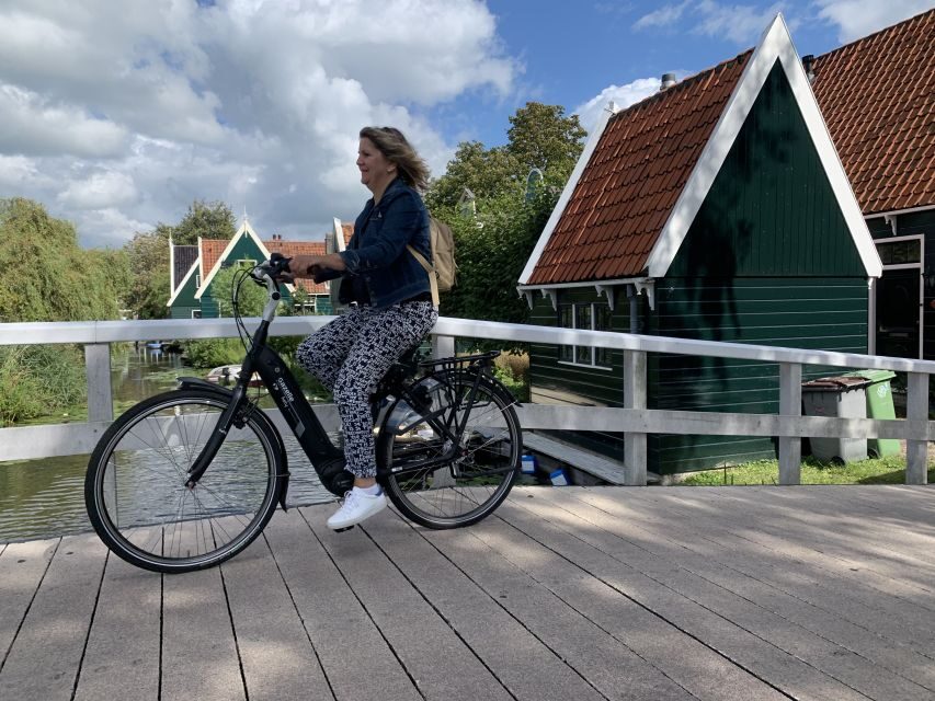 Amsterdam: Countryside Bike Tour and Zaanse Schans Windmills - Weather and clothing: how to avoid the wet-part blues