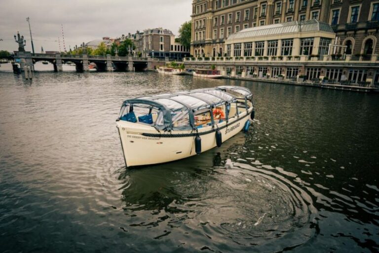 Amsterdam: Covered Canal Booze Cruise with Unlimited Drinks - Covered boat comfort and warm blankets (even when it rains)