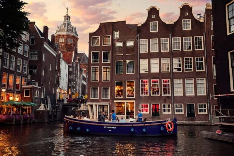 Amsterdam: Evening Candle Light Cruise With Wine & Cheese - The 1-hour route: Red Light District, NEMO, Herengracht, Seven Bridges
