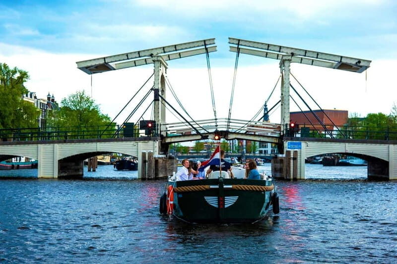 Amsterdam Evening (Sunset) Canal Cruise w/ optional drinks - Electric boats, covered comfort, and what “small group” really buys you
