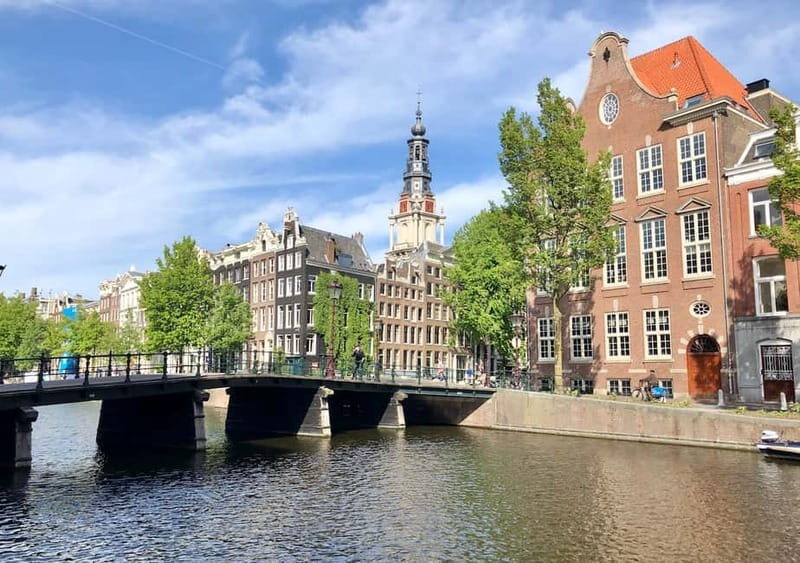 Amsterdam: German Canal Cruise with Unlimited Drinks Option - Entering the Amsterdam canal scene from the water
