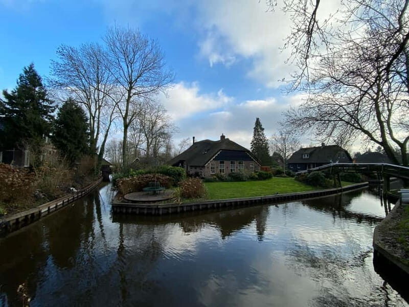 Amsterdam: Giethoorn, Afsluitdijk and Zaanse Schans Day Trip - Zaanse Schans Windmills and Wooden Houses Without the Chaos