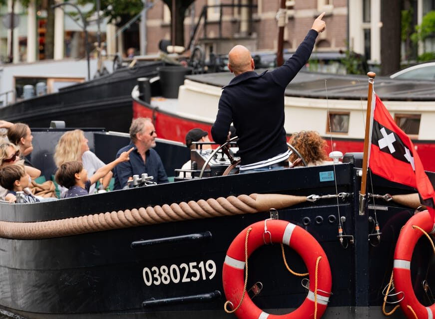 Amsterdam: Guided Open Boat Cruise Unlimited Drinks Option - Who’s running the show: local skipper + local guide make the difference