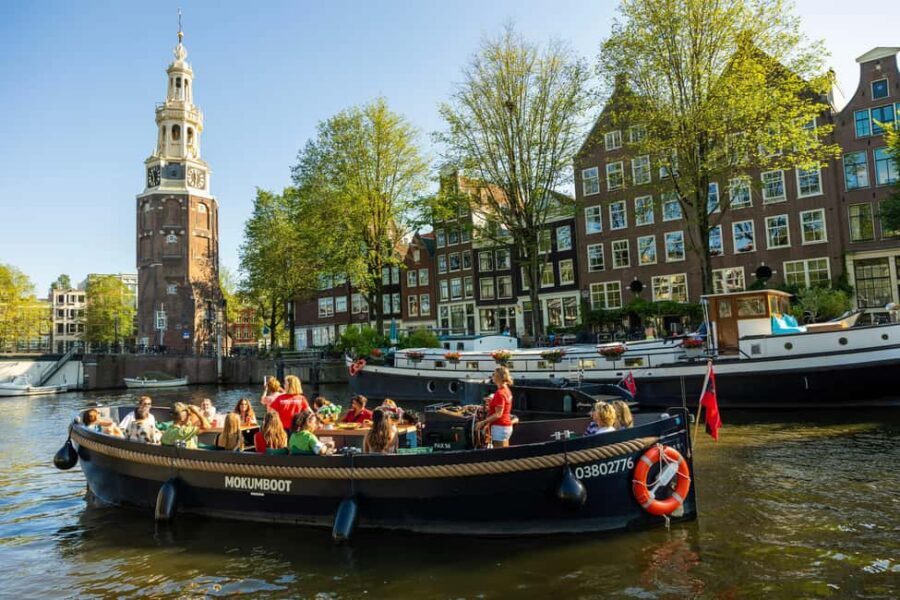 Amsterdam: Guided Open Boat Cruise Unlimited Drinks Option - Canal houses and classic bridges: the “repeat look” stops