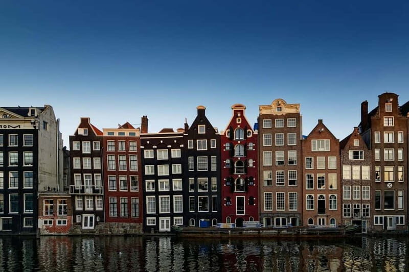 Amsterdam: Iconic Canals & Historic Sights Walking Tour - Oude Kerk in the Red Light District: Old Stone Meets Modern Life