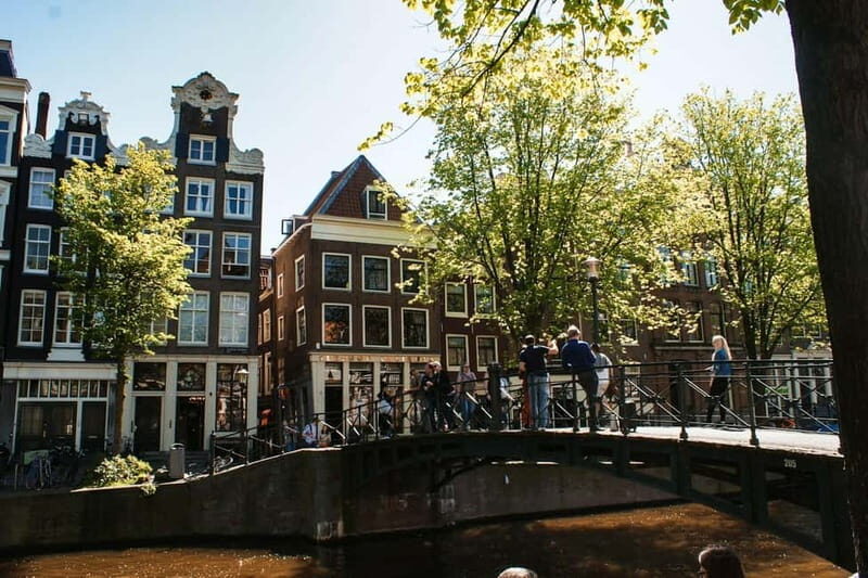 Amsterdam: Iconic Canals & Historic Sights Walking Tour - Jewish Quarter: Wartime Stories That Stay Human