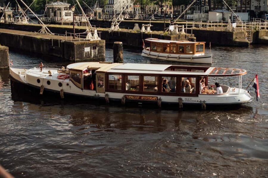 Amsterdam: Luxury Saloon Boat Cruise with Cocktails & Waffle - Luxury saloon comfort on Amsterdam’s canal loop