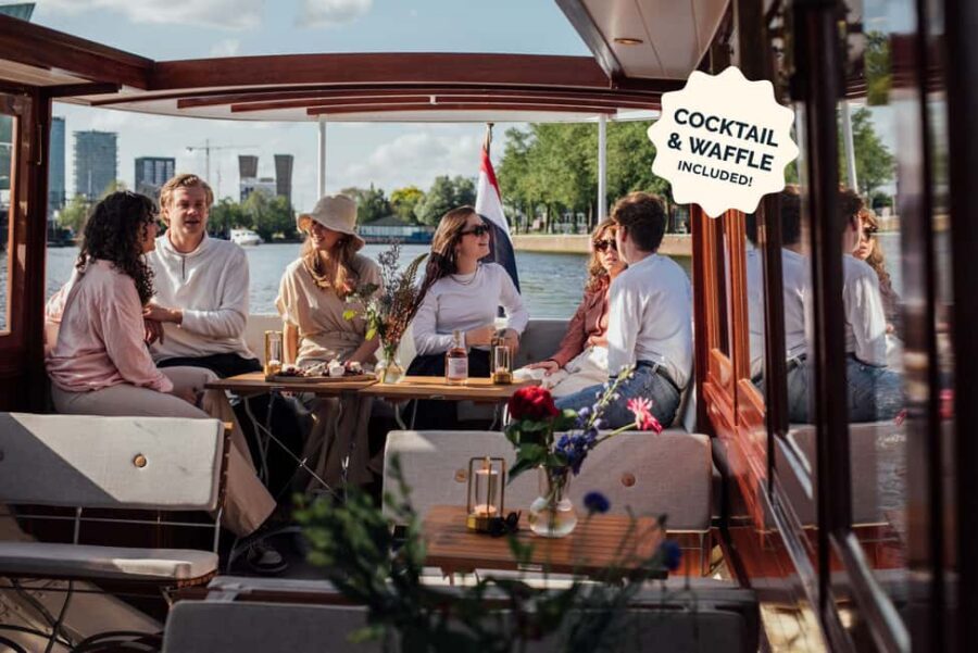 Amsterdam: Luxury Saloon Boat Cruise with Cocktails & Waffle - Meeting points and timing: three docks, one-hour sightseeing