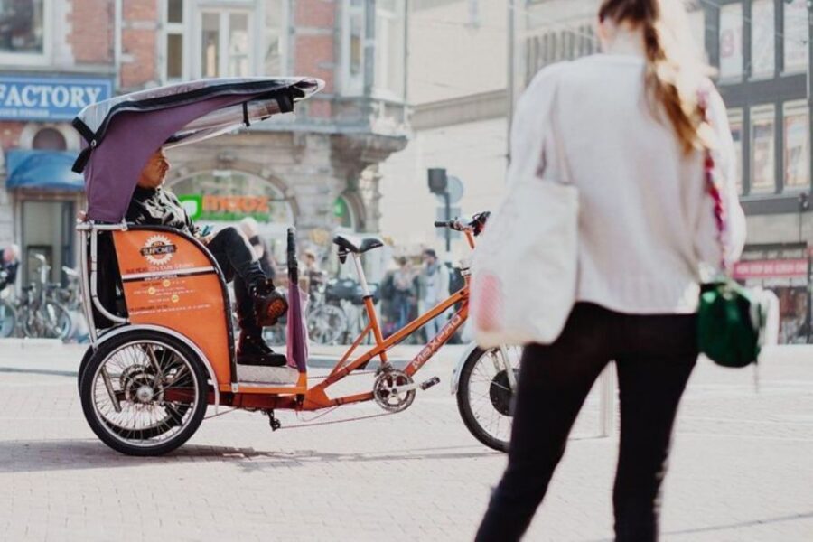 Amsterdam: Private Guided City Tour by Pedicab - Damrak and Dam Square: the classic first stop without the crowd crush