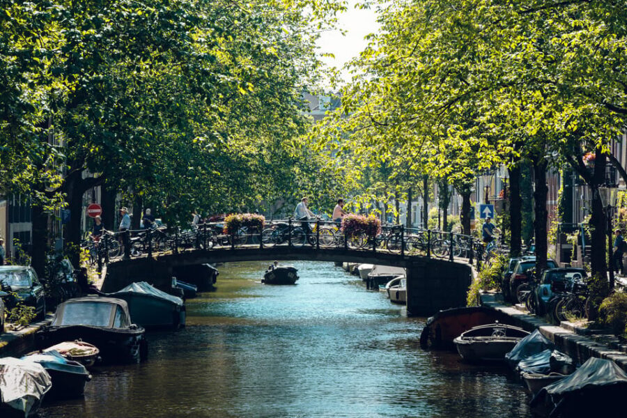 Amsterdam: Relaxed City Highlights Guided Bike Tour - The Canal Belt Grachtengordel Ride: Houses, Clues, and a Tiny-House Game