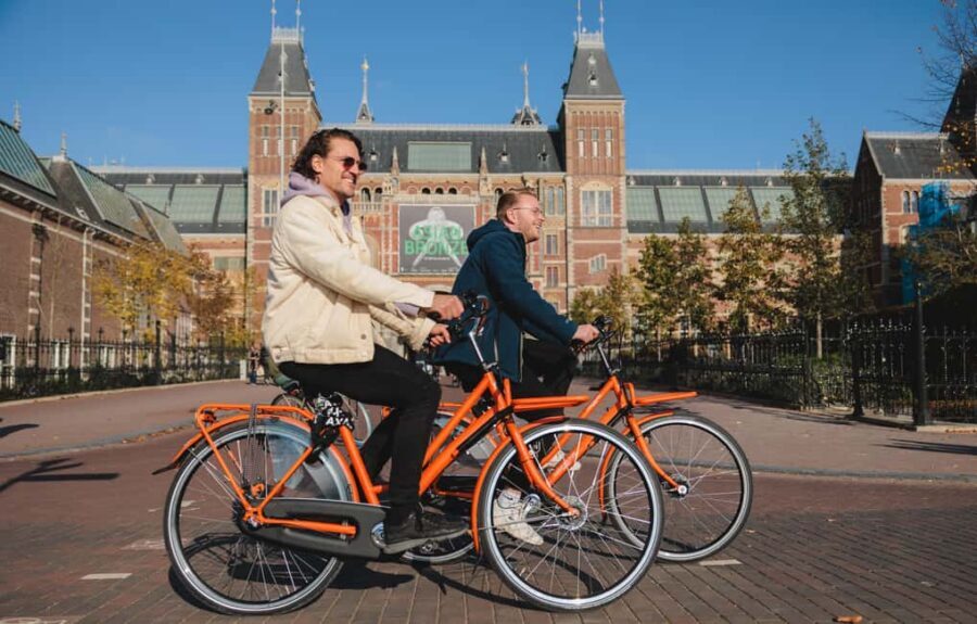 Amsterdam: Top Highlights Guided Bike Tour - Jordaan District: narrow streets, canal angles, and an easy photo rhythm