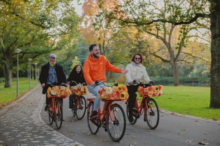 Amsterdam: Top Highlights Guided Bike Tour - Meeting near Central Station: finding the bright orange bikes fast