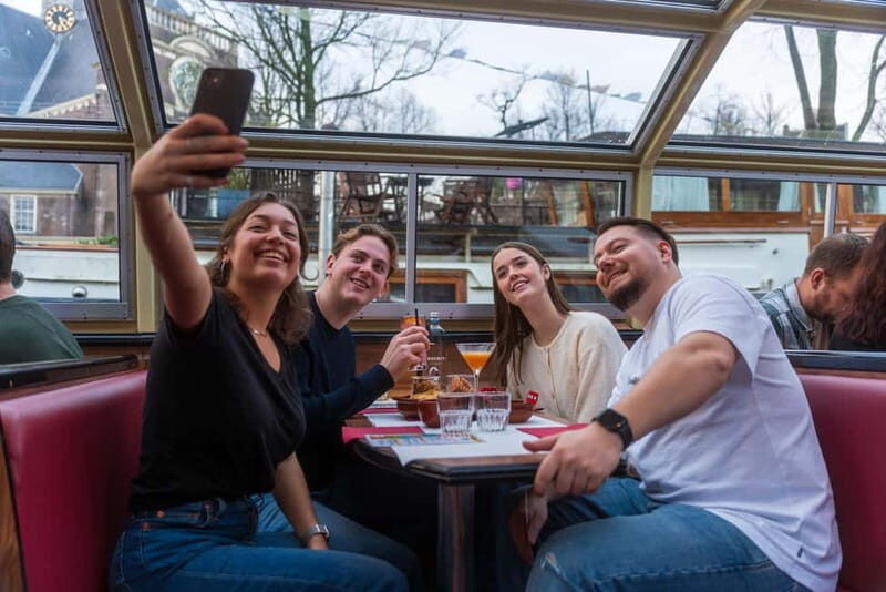 Amsterdam: Unlimited Cocktails Cruise on the Canals - Entering the Damrak Area: where to board and what to expect on arrival