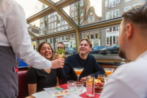 Amsterdam: Unlimited Cocktails Cruise on the Canals - Amsterdam after dark from the water: the UNESCO canal route in real life